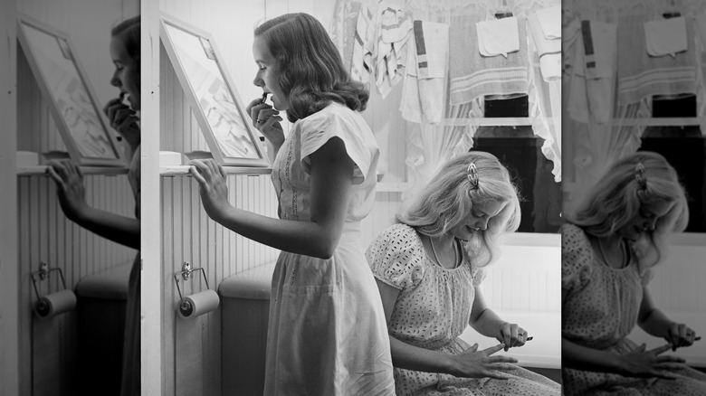 sisters in a room getting ready in the 1950s