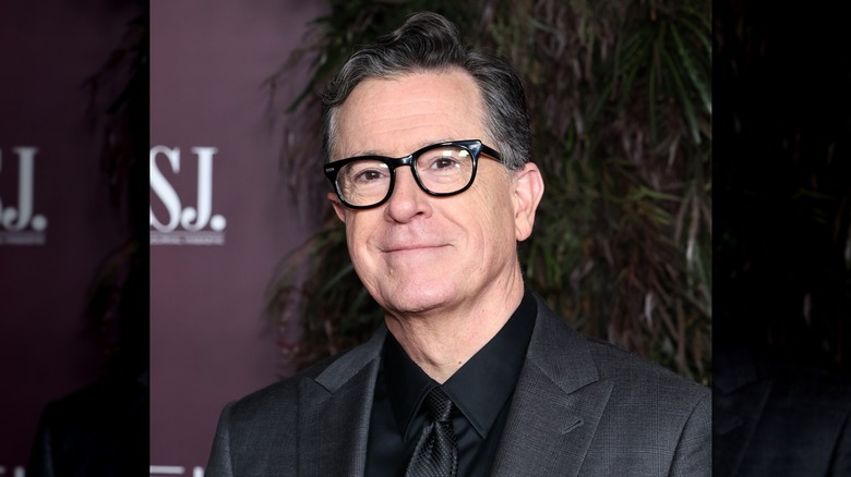 Stephen Colbert posing at a celebrity event