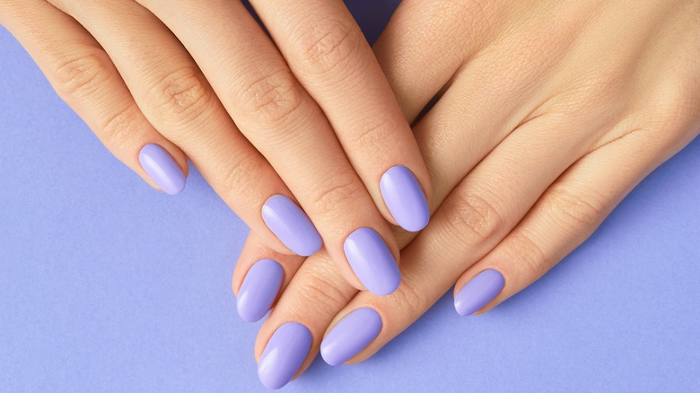 Purple manicured nails