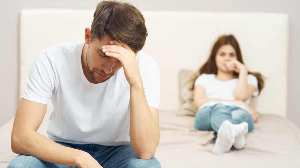 Disappointed man in bedroom