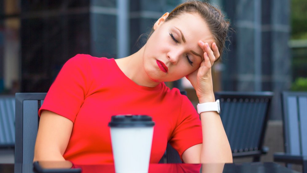 Woman sleeping at table