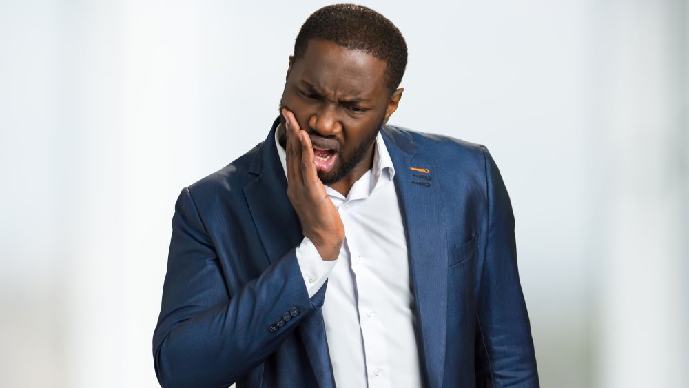 Man with tooth ache
