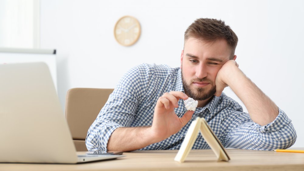 Man procrastinating