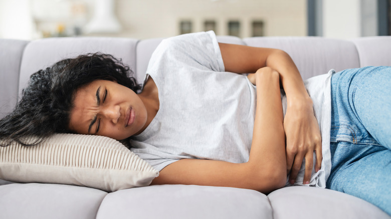 A woman has period cramps