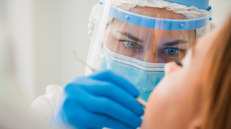 A dentist filling in cavities