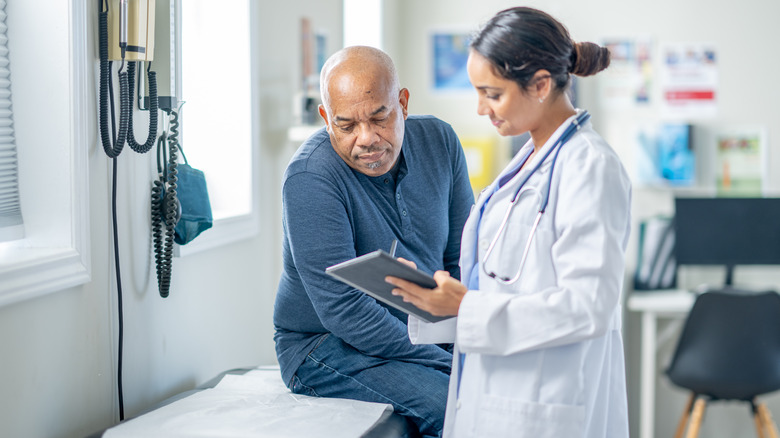 Doctor showing patient chart