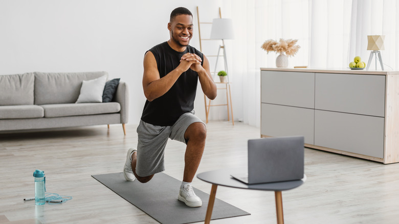 a man lunging during a workout 