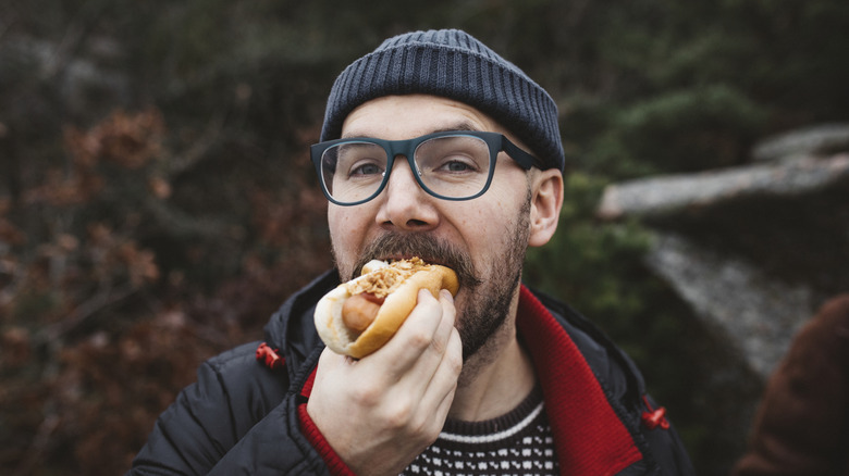 A man eating a hot dog