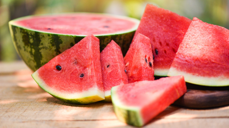 Watermelon slices and half a watermelon