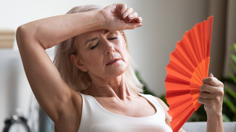 woman fanning herself