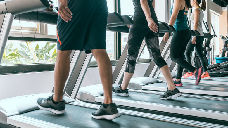 Group of people using treadmills