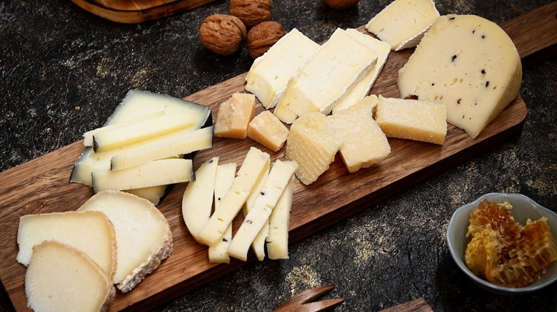 Cheeses on a cutting board
