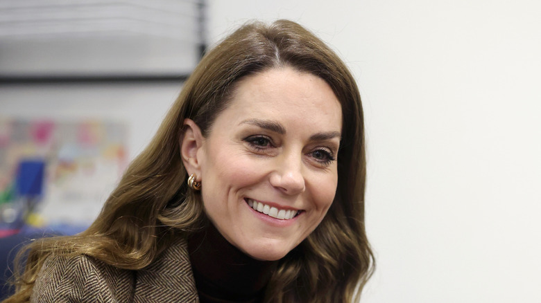 Kate Middleton sitting down and smiling