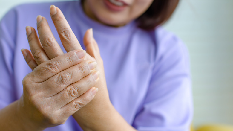 Woman rubbing her fingers