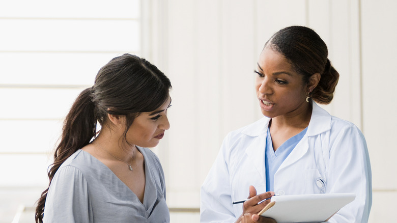 woman talking to her doctor