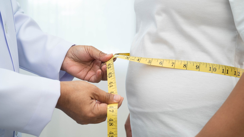 Person having stomach measured