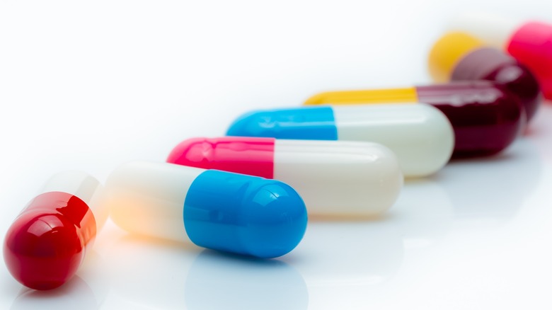 Colorful pill capsules white background