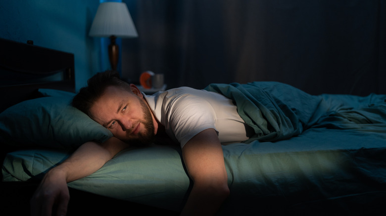 man waking up at night