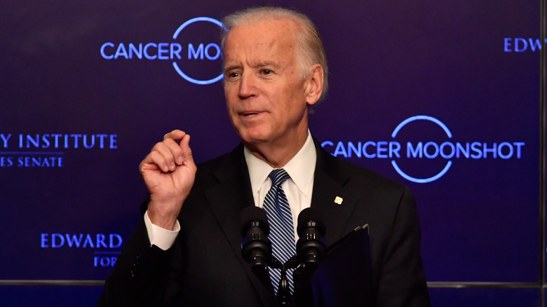 President Joe Biden against "Cancer Moonshot" background