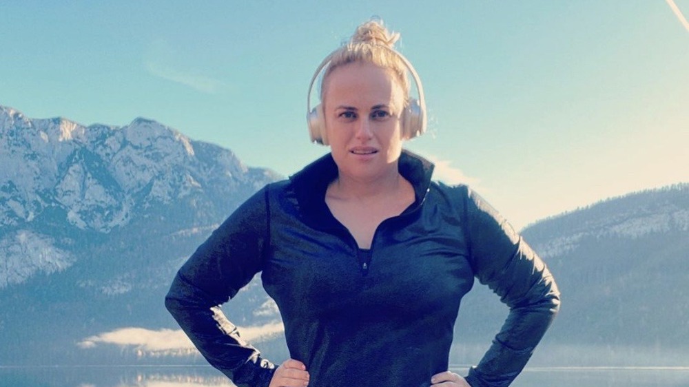 Rebel Wilson hiking with headphones on