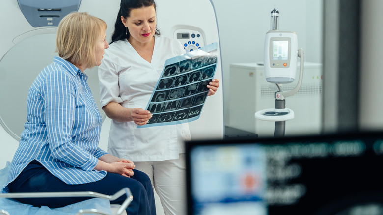 medical expert discussing xray diagnostic with patient