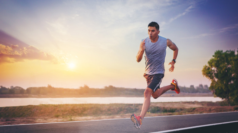 Athletic man running outdoors