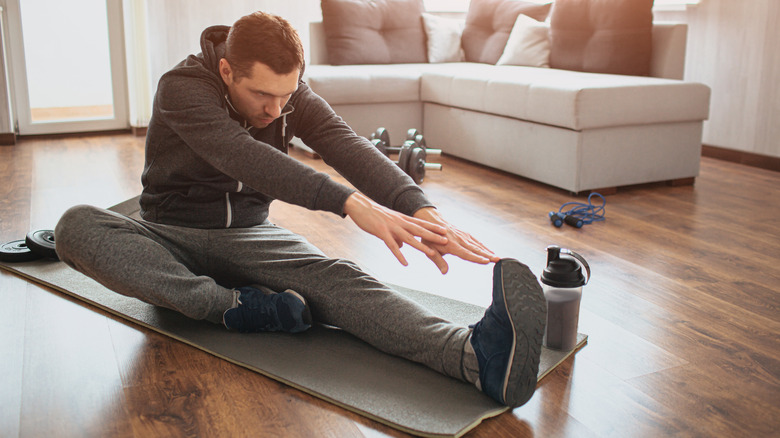 Man stretching leg