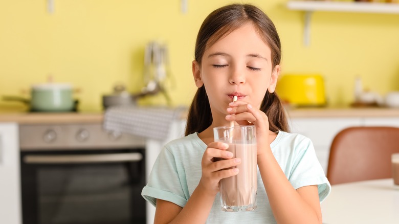 Girl drinking chocolate milk