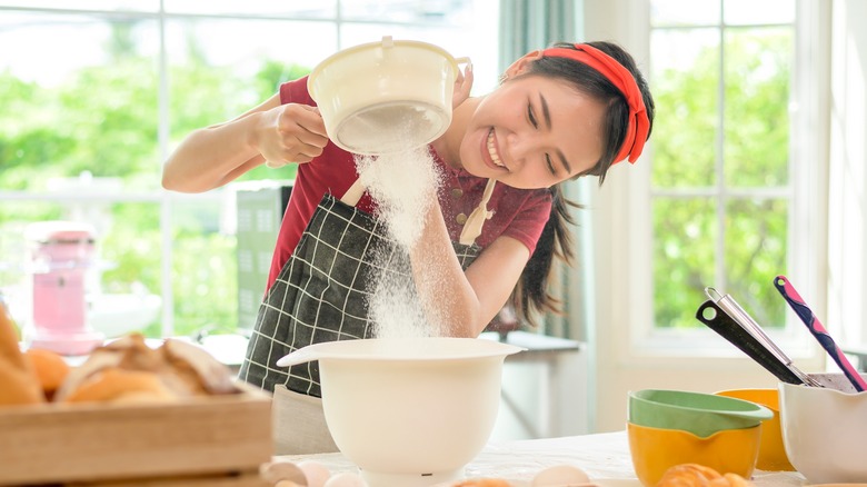 Young woman baking at home