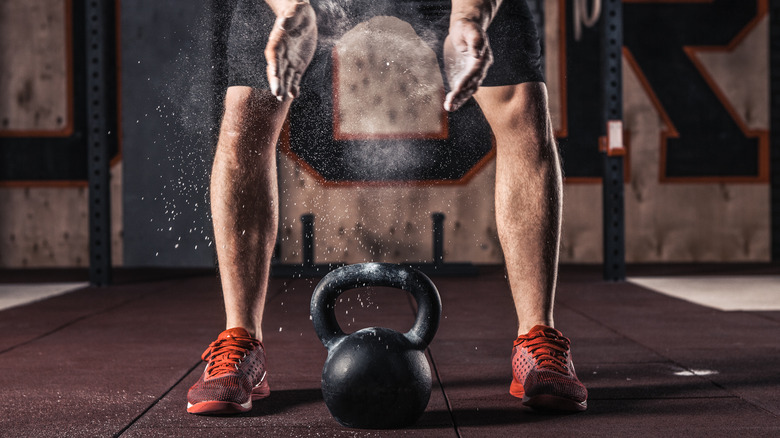 Man preparing to use kettlebell