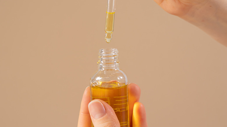 Bottle of castor oil with a dropper