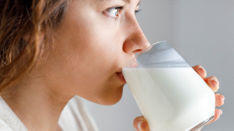 Woman drinking milk from glass