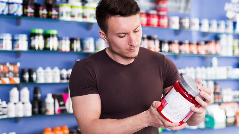 man reading nutrition label