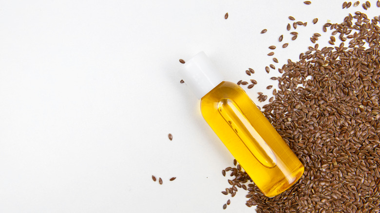 Flaxseeds and bottle of oil