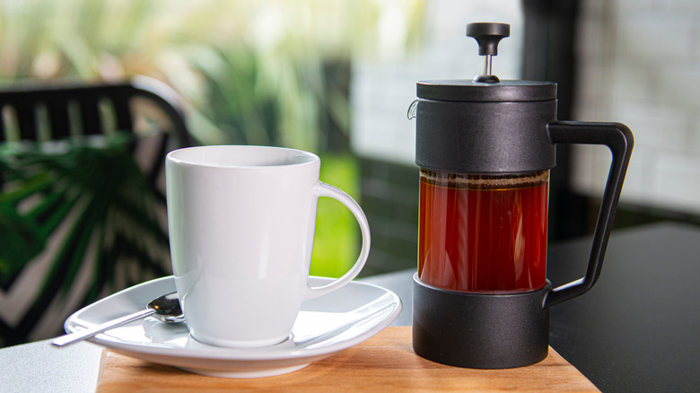 Coffee cup and French press