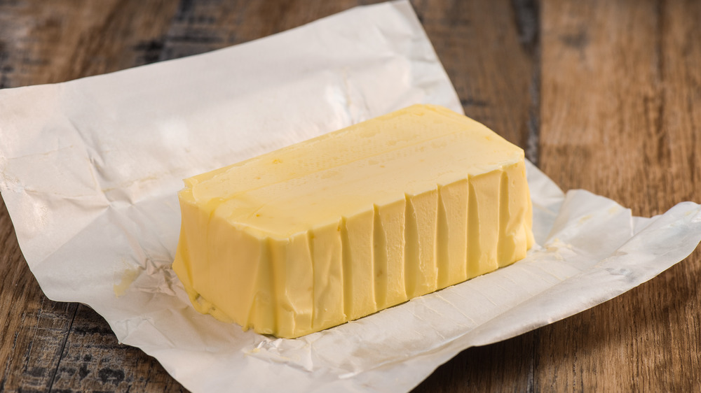 unwrapped butter on a table