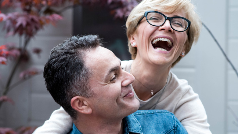 couple laughing outside