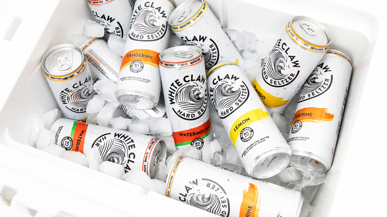 Cans of white claw spiked seltzer in ice chest