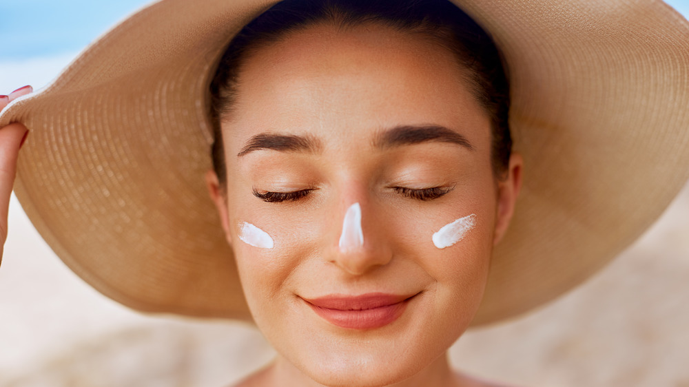 Woman wearing sunscreen