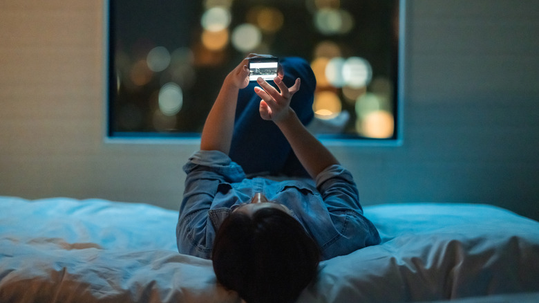 Woman on phone at night