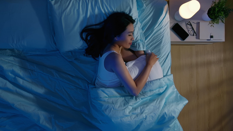 young woman sleeping with her hair loose 