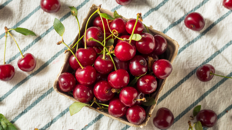 Pack of organic tart cherries on cloth