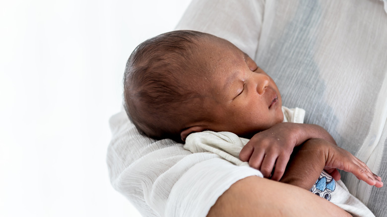 Person holding baby