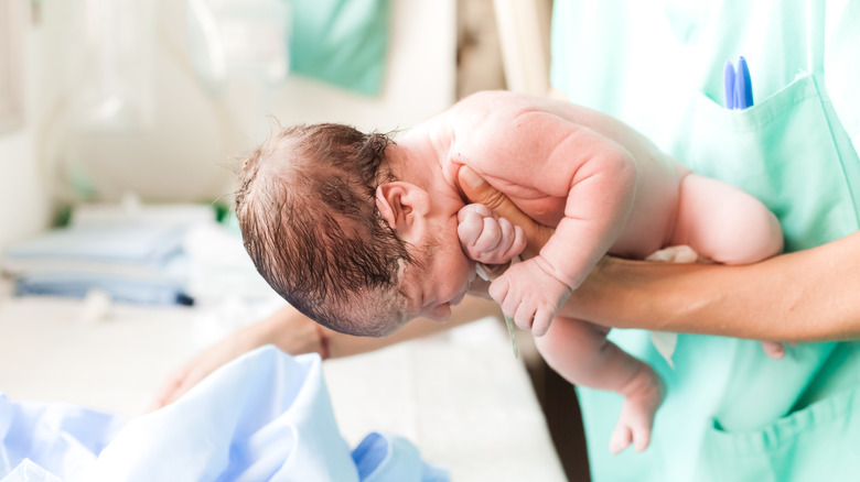 Baby being born