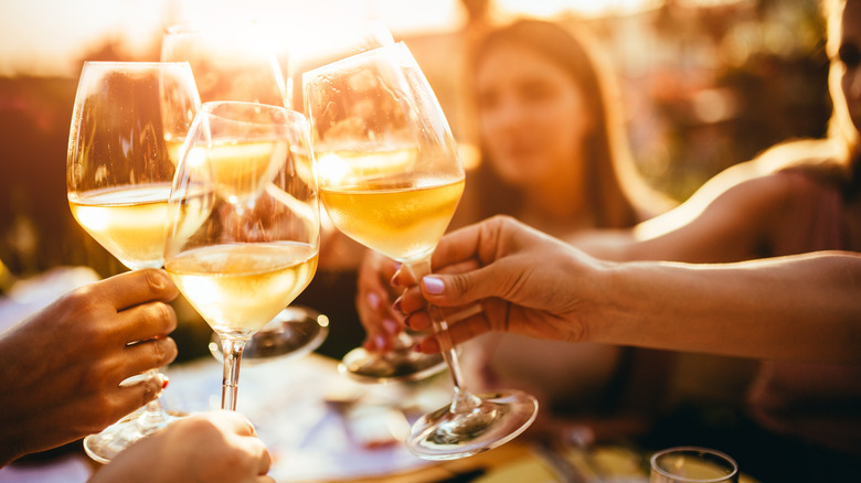 Friends drinking wine at a party