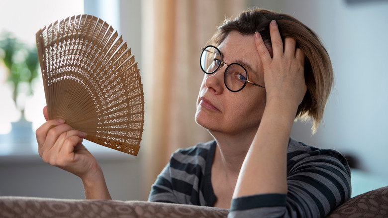 Woman fanning herself