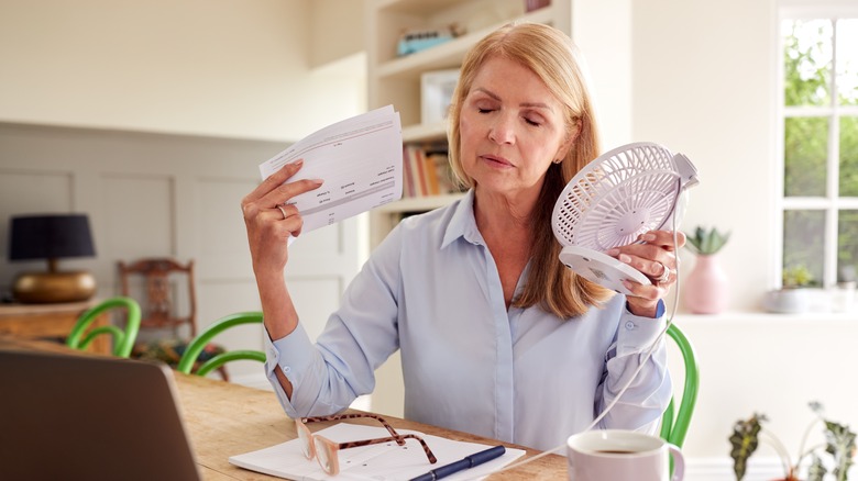 sweating woman cooling down at home