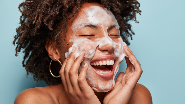 Woman washing her face