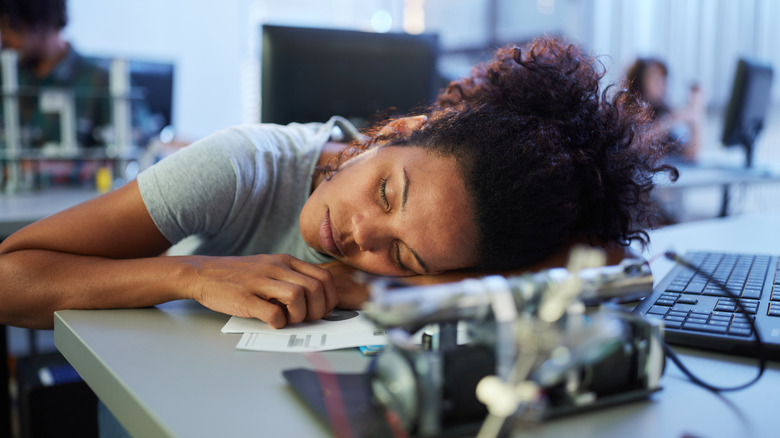Woman sleeping at work
