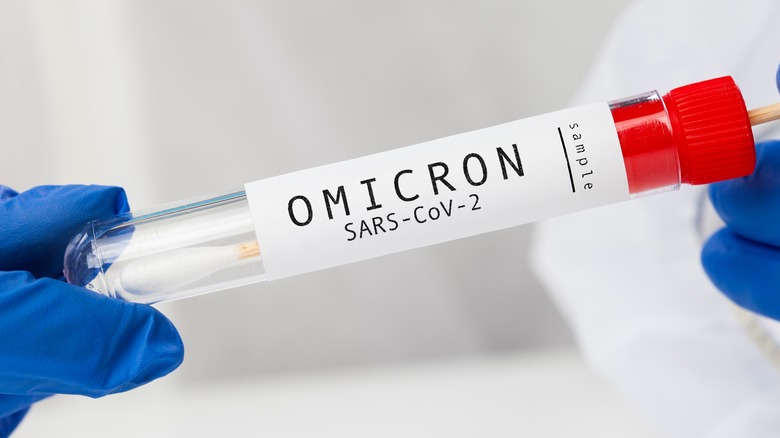 Test tube containing swab test labeled OMICRON